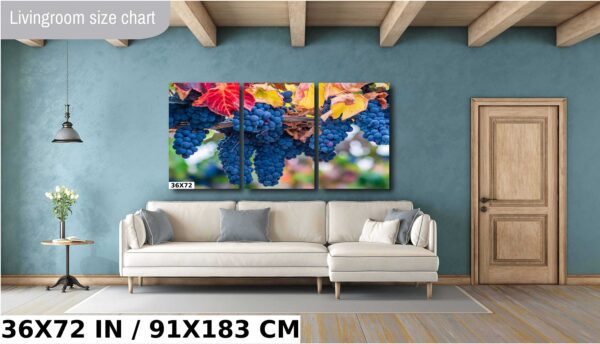 A couch and some flowers on the wall