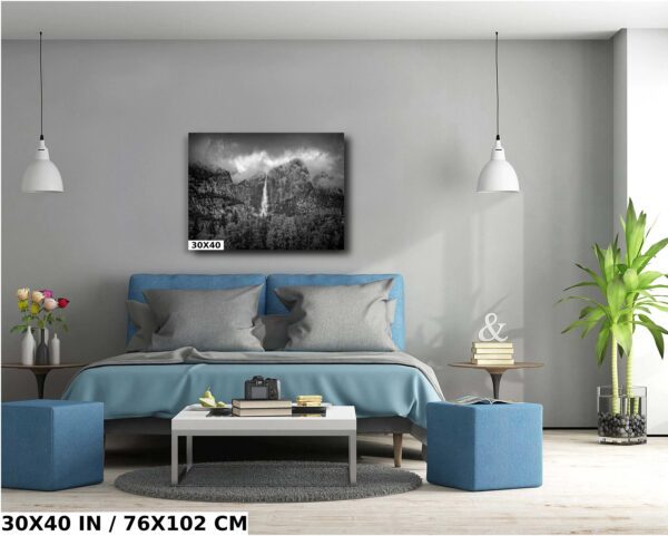 A bedroom with a blue bed and gray walls
