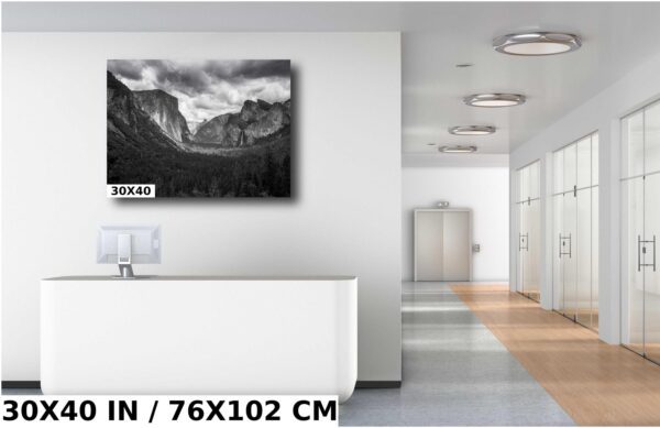 A black and white photo of mountains in the background.