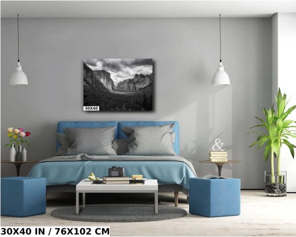 A bedroom with a blue bed and grey walls