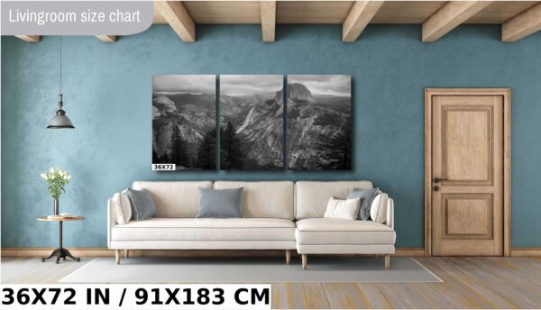 A living room with a couch and a wall mounted picture