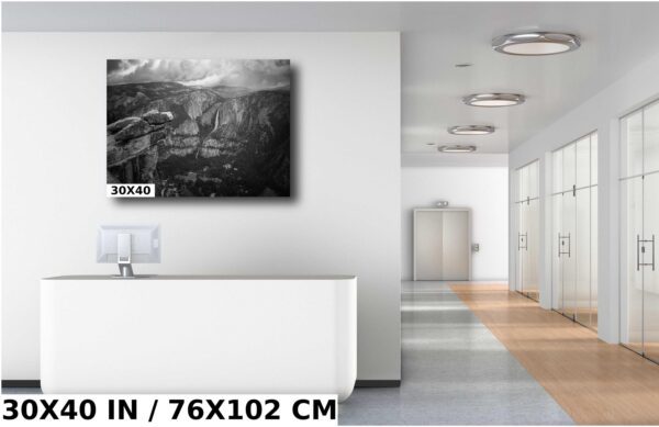 A large black and white painting of a mountain range