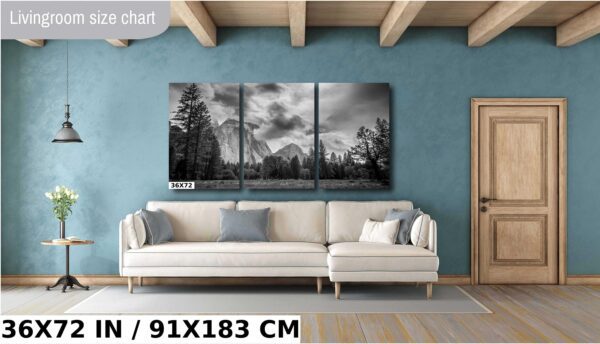 A living room with a couch and a wall hanging