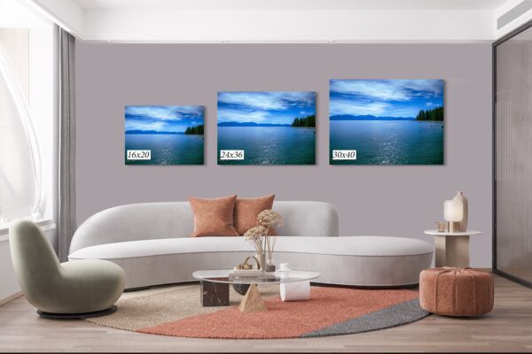 A living room with three pictures on the wall
