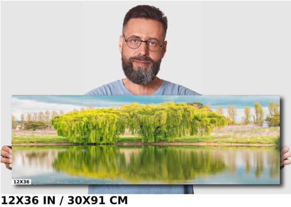 A man standing in front of a large painting.