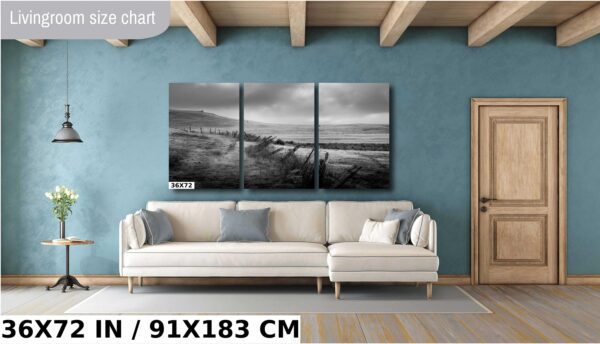 A living room with a couch and a wall hanging