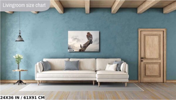 A white couch sitting in front of a blue wall.