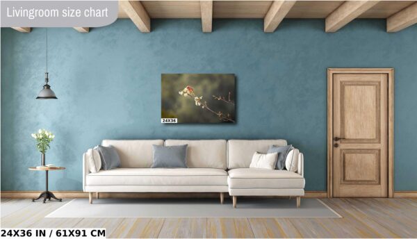 A living room with a couch and a painting on the wall