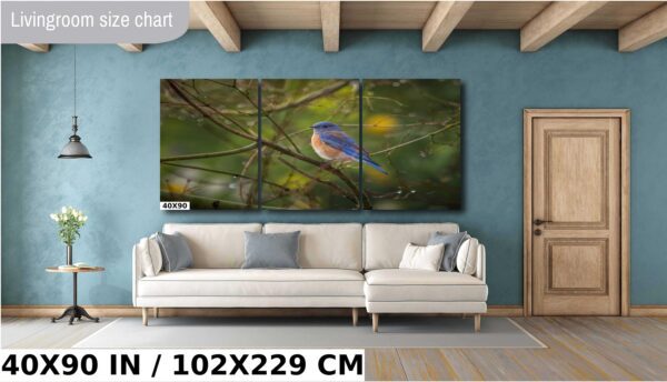 A blue bird sitting on the branch of a tree.