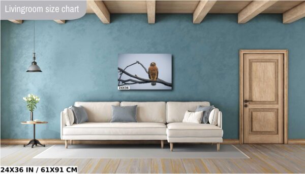 A couch and a painting in a room.