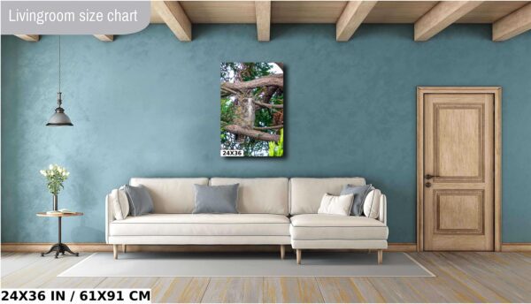 A living room with a couch and a painting on the wall