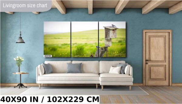 A large wall with three pictures of a field