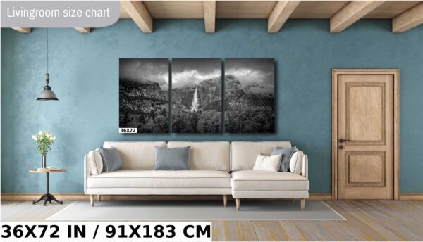 A living room with a couch and a wall hanging