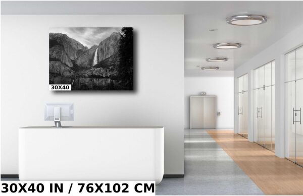 A large black and white photo of a waterfall