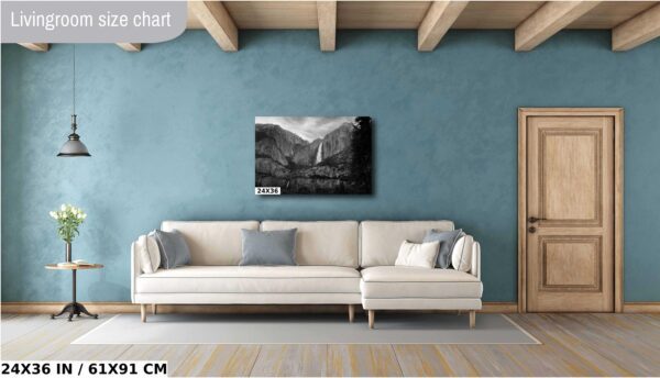 A living room with a couch and a painting on the wall