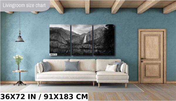 A living room with a couch and a wall hanging