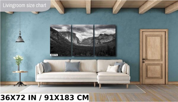 A large wall with three pictures of mountains