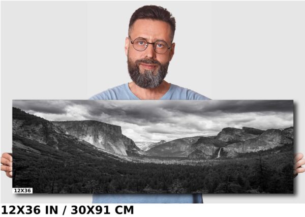 A man standing in front of a large painting.