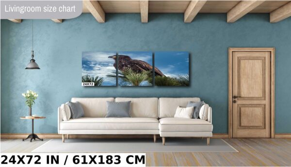 A couch and a wall with some pictures on it