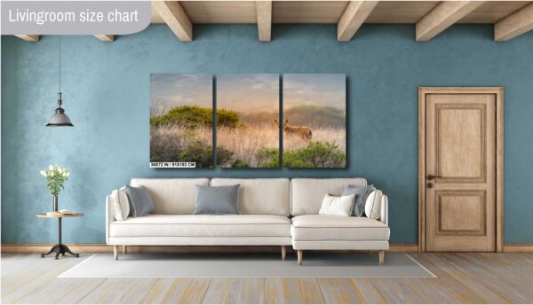 A living room with a couch and a painting on the wall