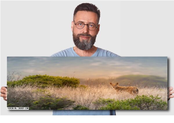 A man is standing in front of a painting