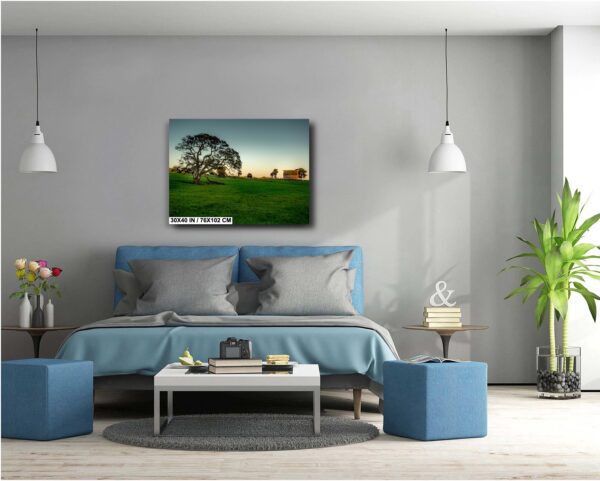 A bedroom with a bed and two blue ottomans