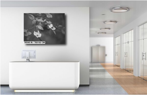 A bathroom with a white tub and a large painting