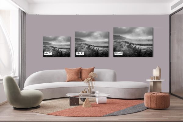 A living room with three pictures on the wall