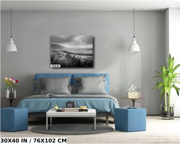 A bedroom with a blue bed and gray walls