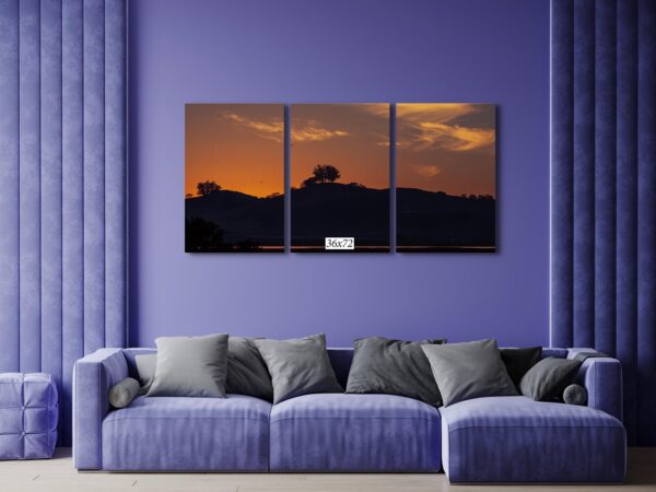 A living room with purple walls and a couch