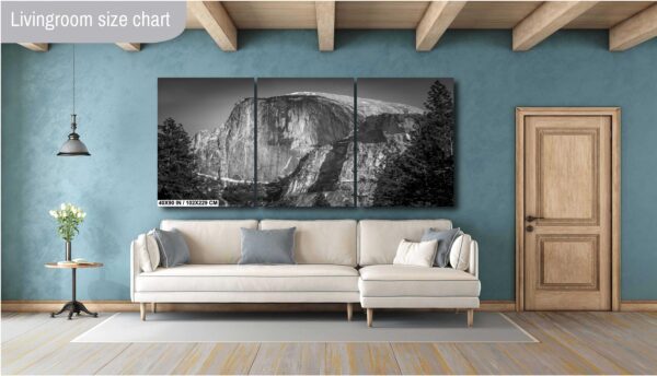 A living room with a couch and a wall hanging