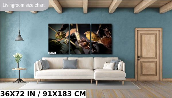 A living room with a couch and some paintings