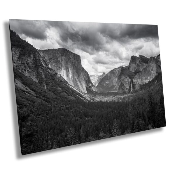 A black and white photo of mountains with clouds