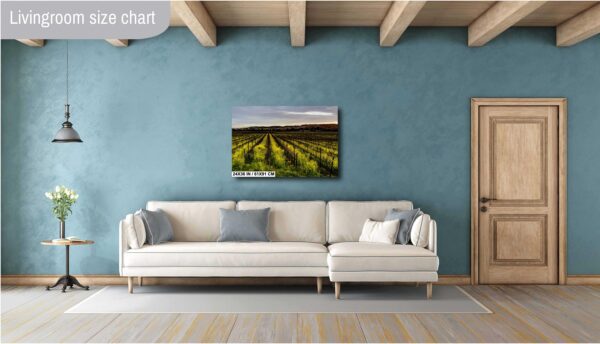 A living room with a couch and a painting on the wall