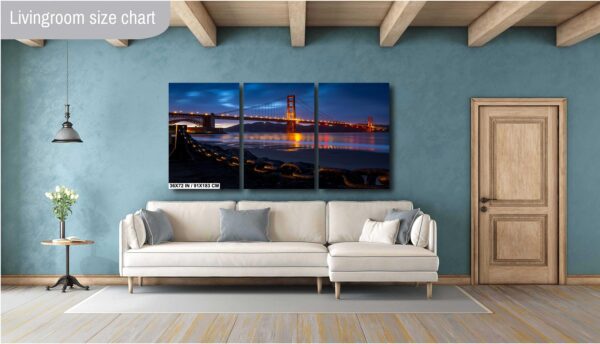 A living room with a couch and a wall hanging