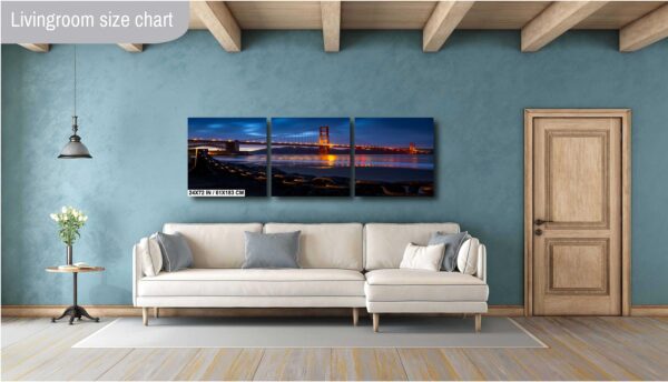 A living room with a couch and wall art