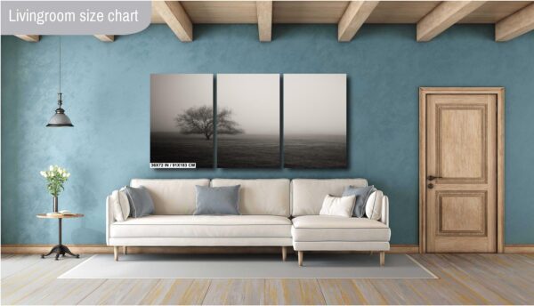 A living room with a couch and a wall hanging