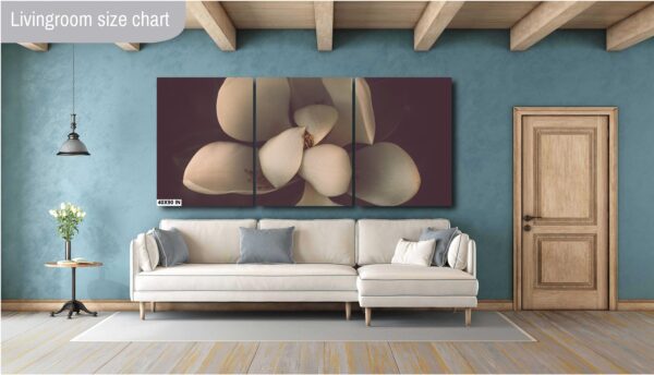 A living room with a couch and a wall hanging