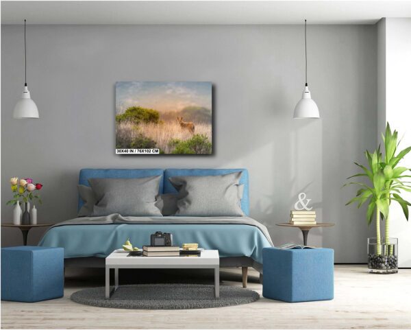 A bedroom with a bed, lamps and a painting.