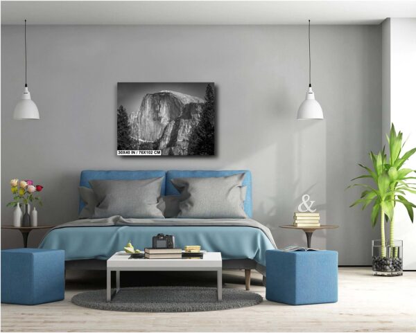 A bedroom with a bed and two lamps