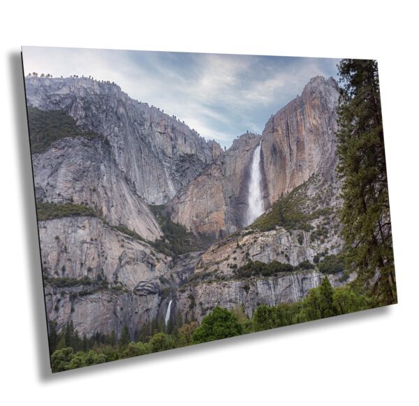 A mountain with water falling down the side of it