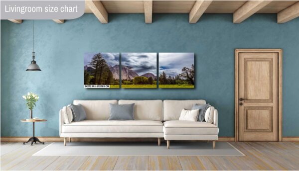 A living room with a couch and a wall hanging