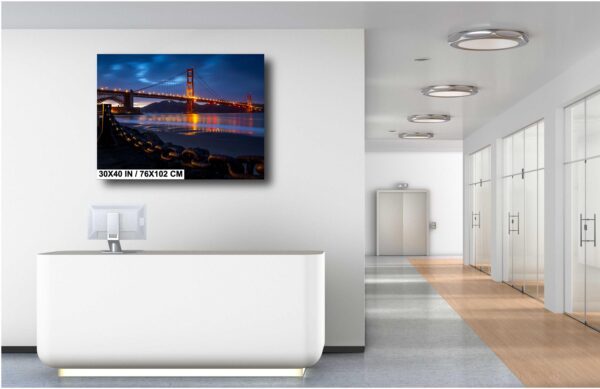 A bathroom with a television mounted on the wall.
