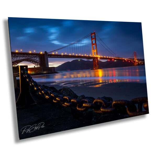 A bridge that is lit up at night.