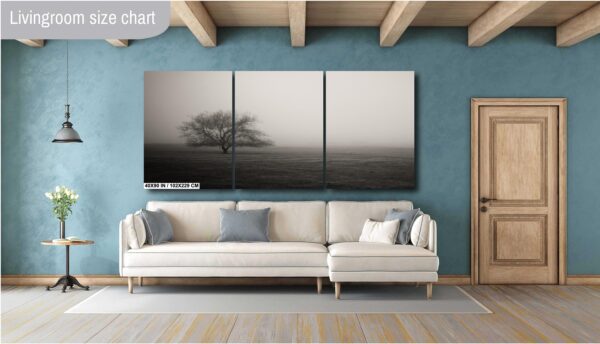 A living room with a couch and a wall hanging