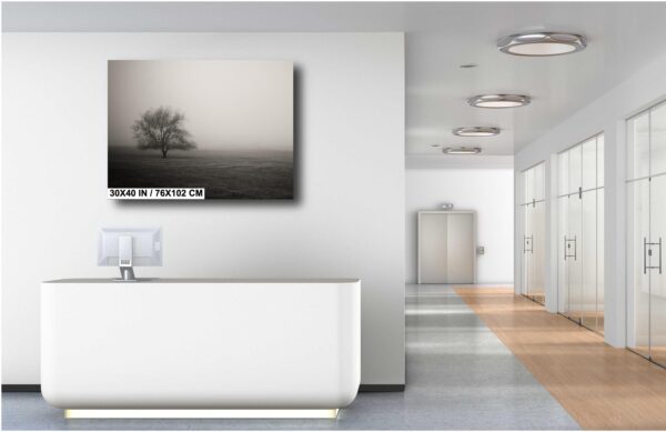 A bathroom with a large white tub and a painting on the wall.