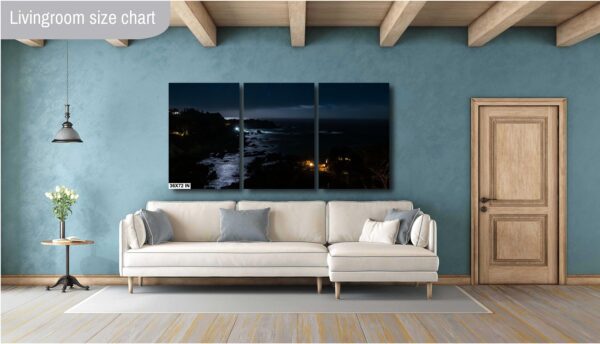 A living room with a couch and a wall hanging