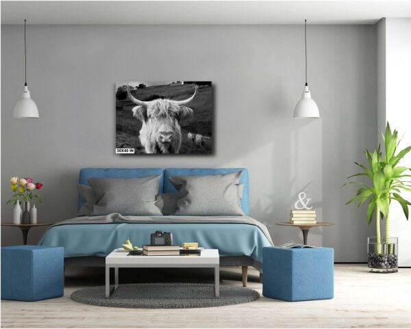 A bedroom with a bed and two blue ottomans.