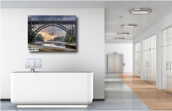 A large painting of a bridge in the middle of a room.