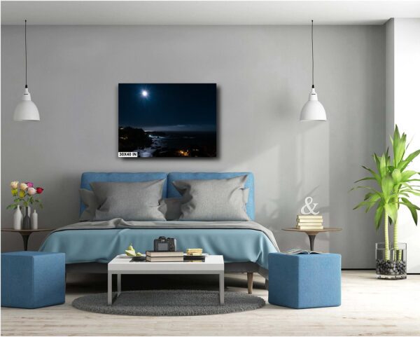 A bedroom with a bed, lamps and a painting.